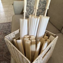 Parasols and Paper Fans With Wicker Basket