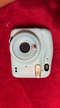 Light blue polaroid camera