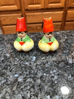 Vintage Porcelain pair of Salt and Pepper Shakers.  No stoppers see pictures.  Size 3 inches.  Made in Japan.  Preowned good condition.
