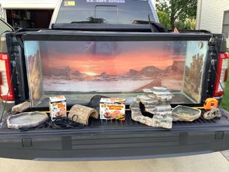 Aquarium for lizards or fish comes with lots of extras this is a 55 gallon aquarium  21” tall, 48” wide and 13” deep.