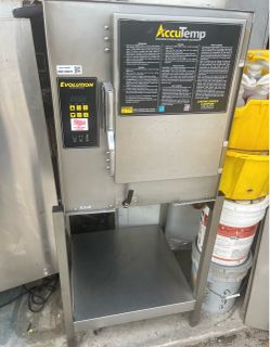 2018 AccuTemp Evolution Boiler-Free Commercial Steamer on stainless stand.  208V Single Phase unit.  Removed from working environment .  Price include