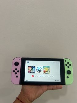 I am selling a Switch console with three physical games and its original accessories.