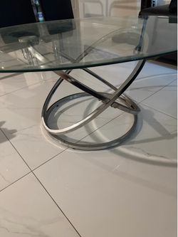 Oval glass & metal coffee table $100