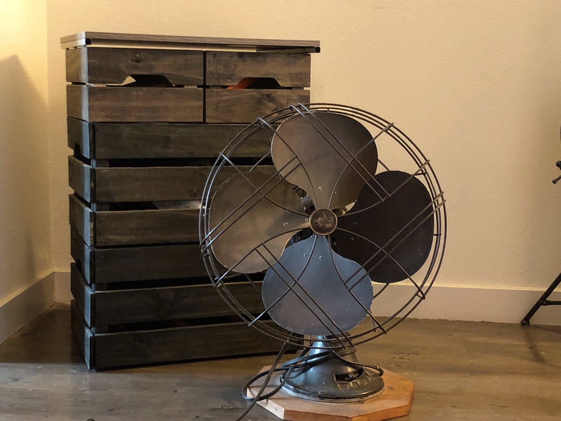 Crate shelf with antique decorative fan