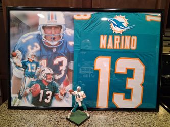 DAN MARINO HALL OF FAMER WITH THE MIAMI DOLPHINS STITCHED,FRAMED JERSEY with ACTION FIGURE.