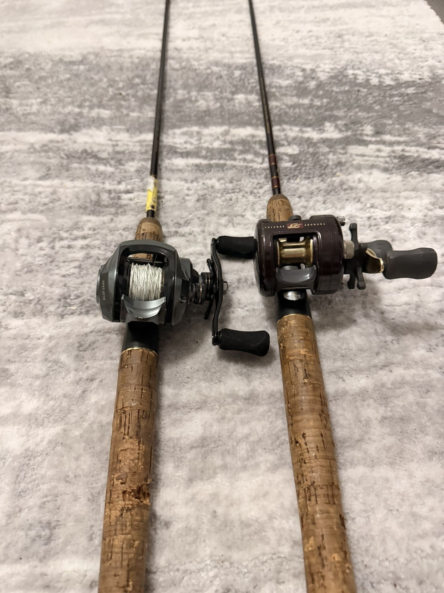 Two bait caster fishing reels