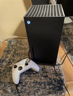 Xbox Series X and white Xbox Controller