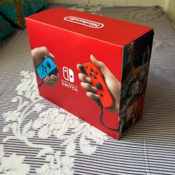 Nintendo Switch With Neon Blue And Neon Red Joy-Con