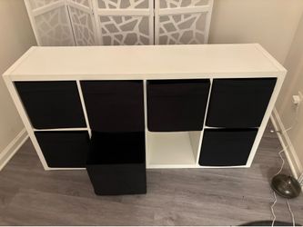 Dresser with pull out material drawer