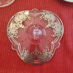 vintage glass serving tray with a silver overlay floral design and a center handle. 