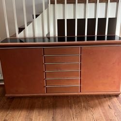 Vintage leather covered buffet with black glass top