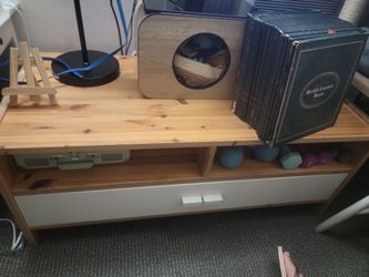 Pine IKEA Tunhem TV console with a white drawer.