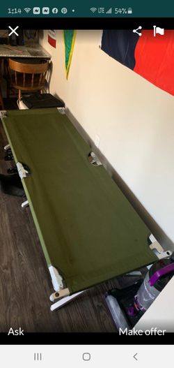 Army cot in New condition used a short time has pocket at the foot