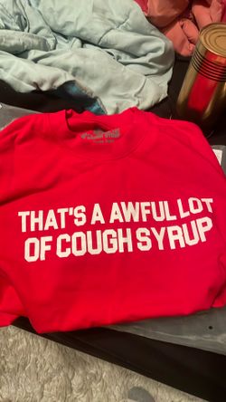 The size is a small and the color is red and the brand is that’s a awful lot of cough syrup