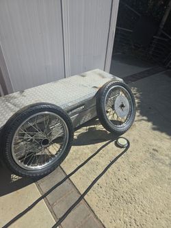 Tea bucket or nostalgia Drag Racing front wheels
 Or just man cave art