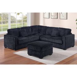 Black jumbo corduroy sectional sofa with ottoman
