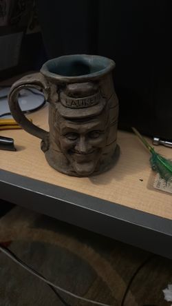 his is a 1971 Jim Rumph "Laurel and Hardy" two-faced ceramic mug