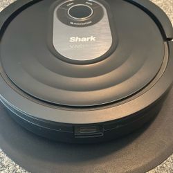 The Shark AI Robot Vacuum Pro offers simultaneous vacuuming and "Sonic Mopping" (100 scrubs/min) using AI Laser Navigation 
