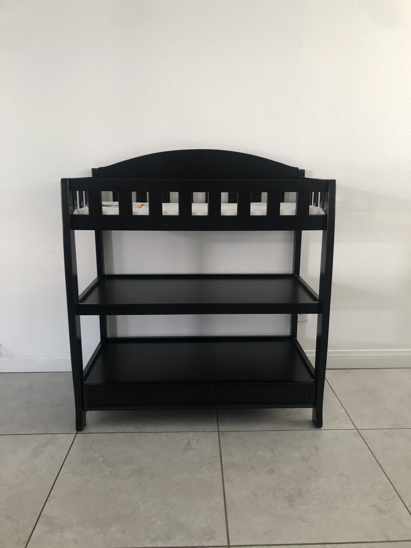 Brand new black changing table with pad