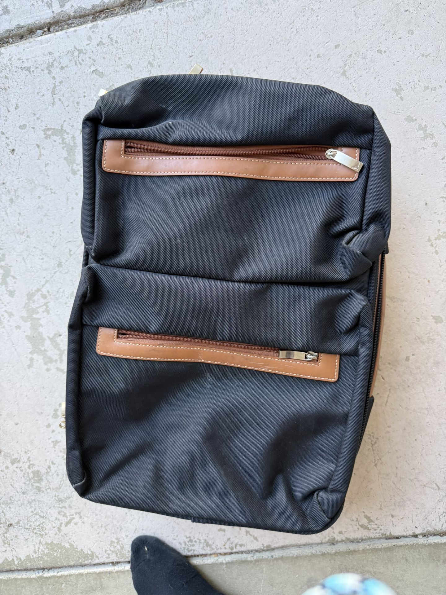 Cool brown and navy rolling suitcase