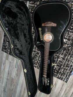 Black Takamine G series 12 string guitar