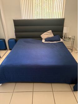 Modern Black Upholstered Bed with Chrome Trim