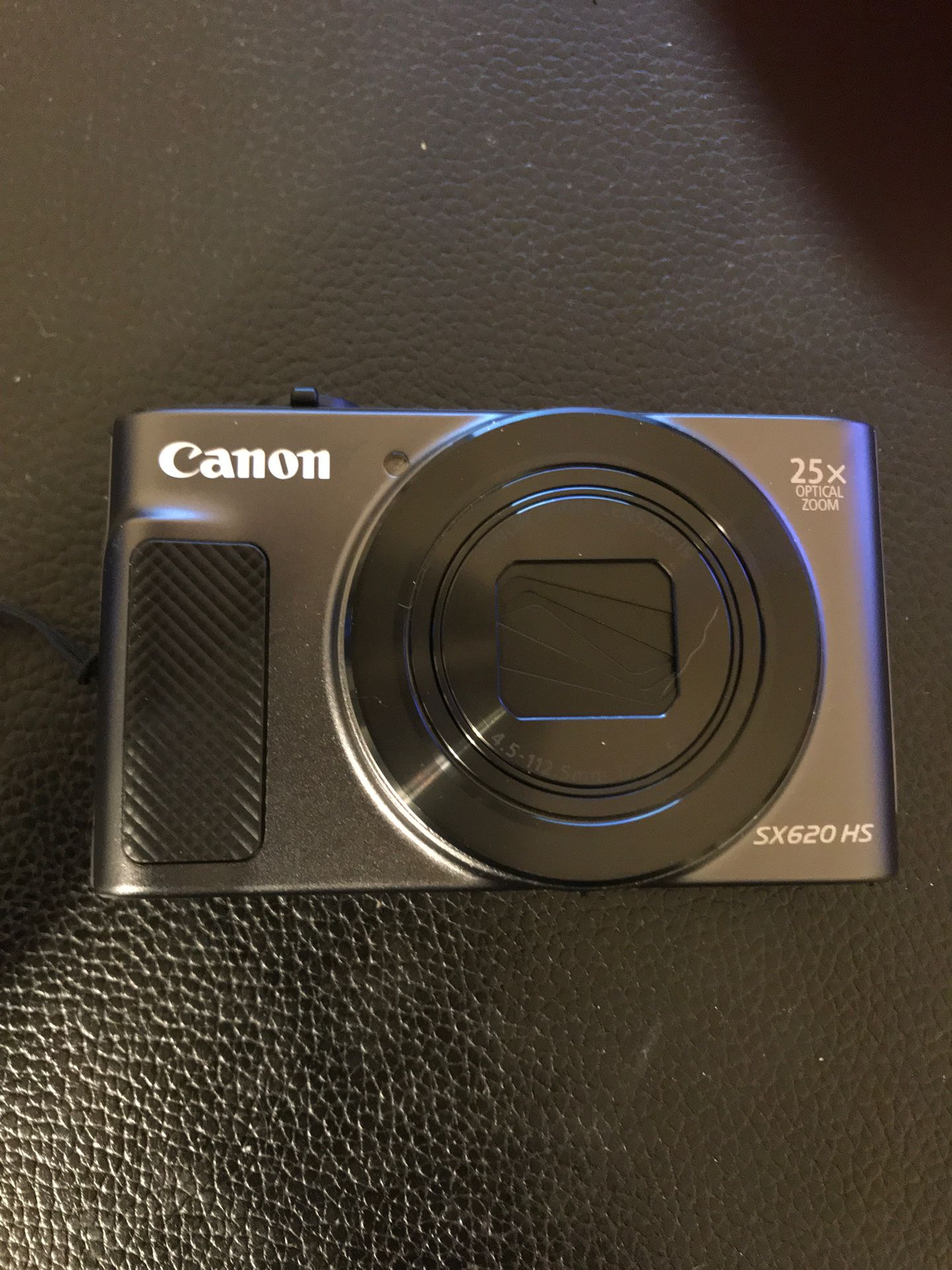 Canon SX620 HS digital camera with case and battery.