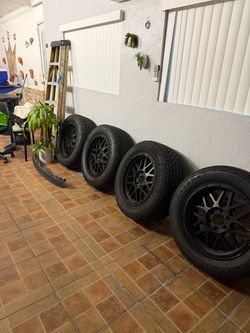 Set of 4 Tires on Black Rims