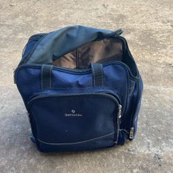 Suitcase for carry-on. Ski boots.