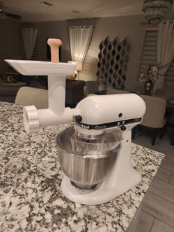 White kitchen aid mixer with all attachments and KitchenAid meat grinder