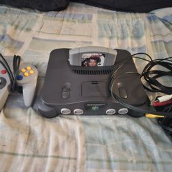 N64, in good condition, with the Golden Eye game, firm price