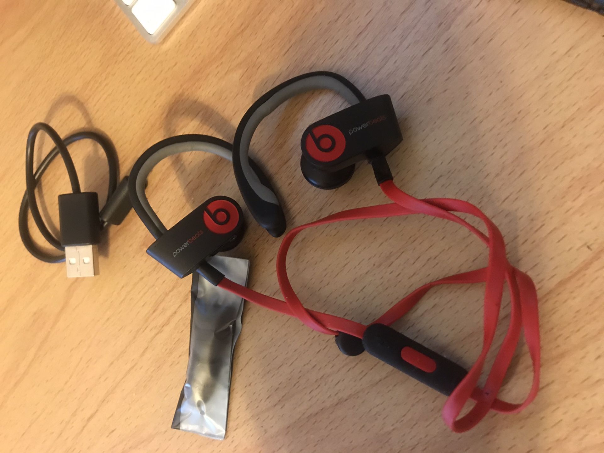 Beats by Dre used red with charger cable and new ear pugs