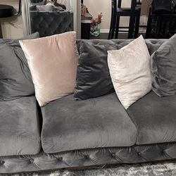 Gray tufted couch 