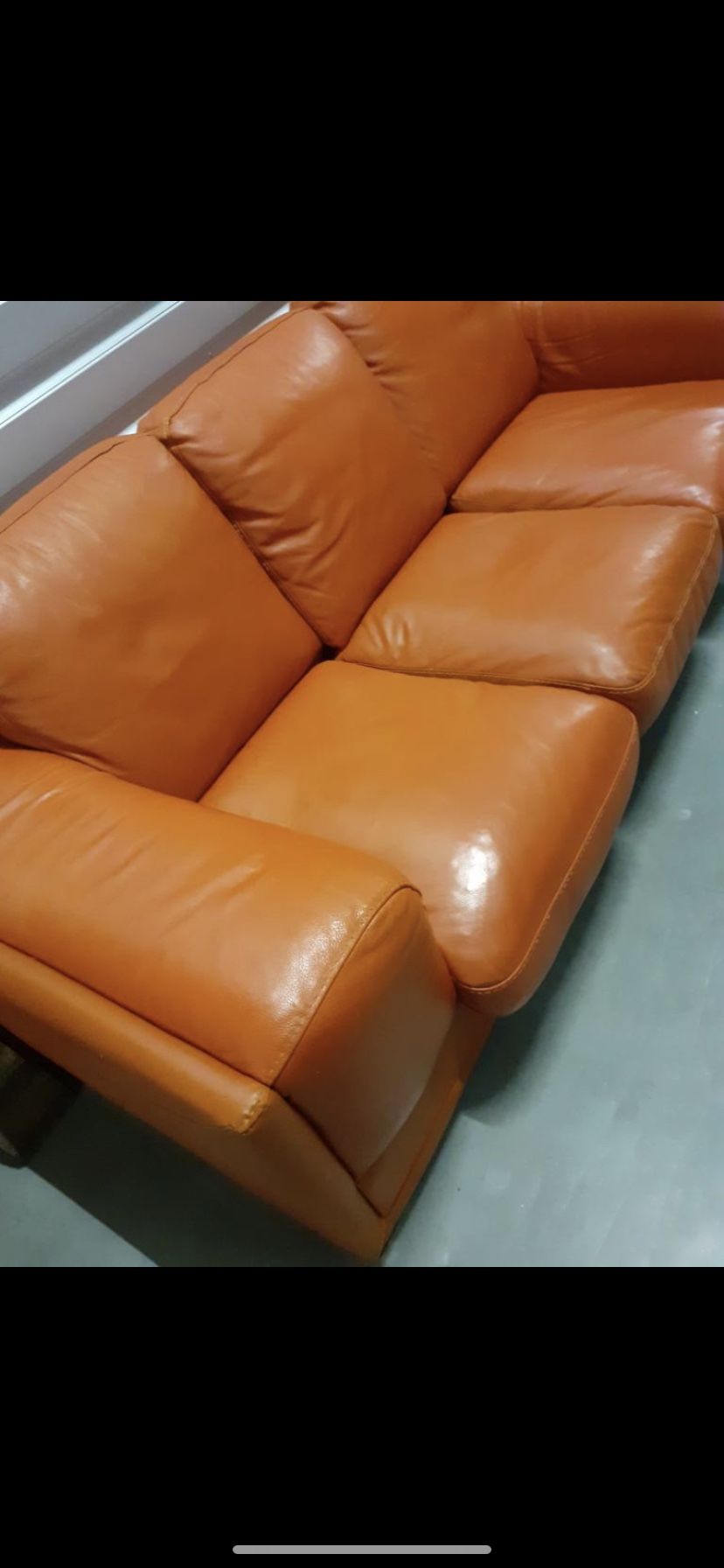 Beautiful Italian leather burnt orange color sofa with matching Loveseat