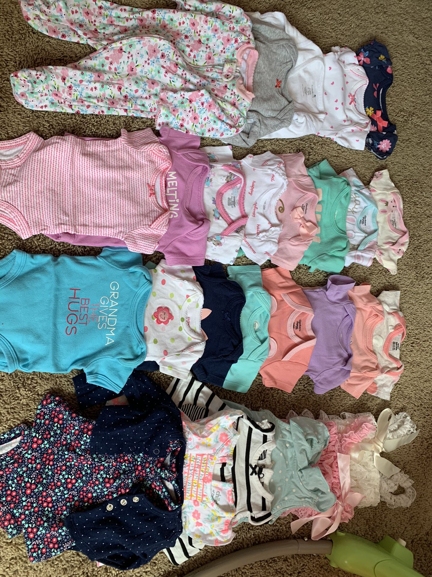 Baby girl clothes ranging from newborn to 6-9 months