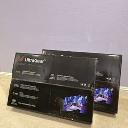 Two LG 32" monitors (32GN50T) and a desk arm