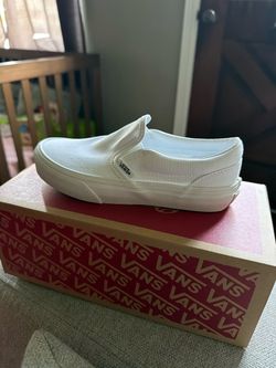 White slip on Vans