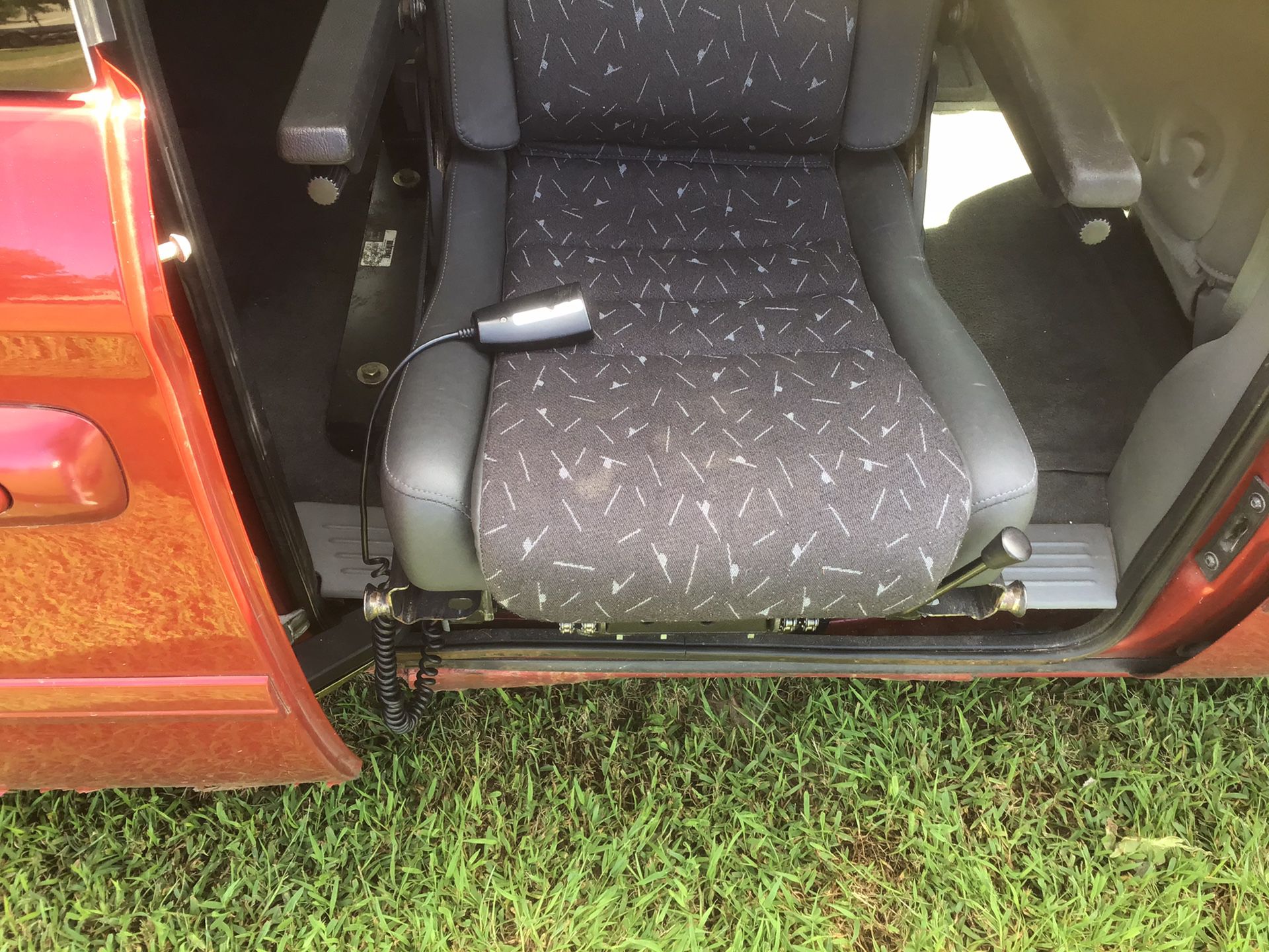 2006 Dodge Grand Caravan, with back seat that lowers and hooks into a wheelchair base to become a wheelchair!