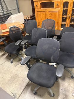 Black office chairs on rollers