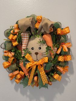 Spring Bunny Wreath adorned with vibrant orange polka dot bows.