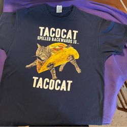 Navy blue cotton t-shirt with cat in a taco graphic and the words 'TACOCAT SPELLED BACKWARDS IS... TACOCAT