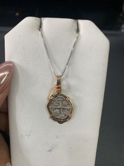 Atocha silver coin pendant in gold bezel with silver chain