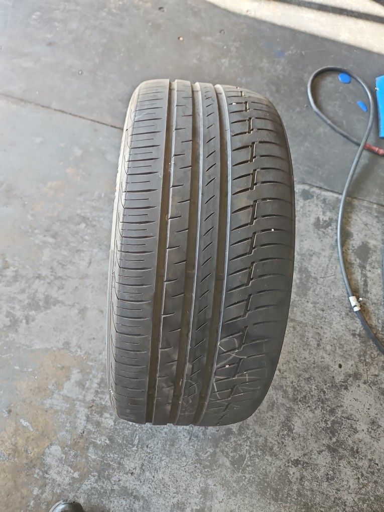 One 275/40/22 Continental Premium Contact