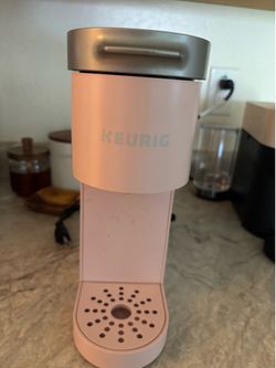 Pink Keurig coffee maker.