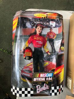 This 1999 Mattel Collector Edition NASCAR Official #94 Barbie doll features a McDonald's racing uniform inspired by driver Bill Elliott. Vintage but n
