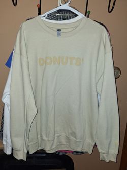 cream-colored crewneck sweatshirt features "DONUTS" embroidered in a similar shade across the chest size Large $30