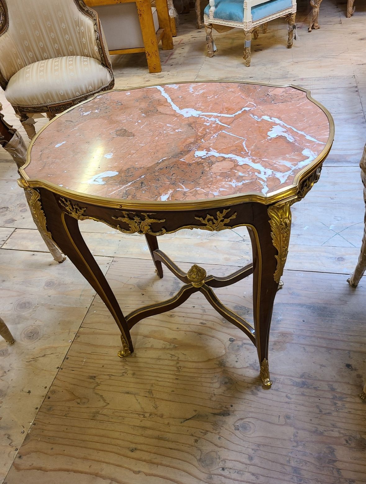 Curio Louis XV Side Table LOOK UP A French Louis XV style side table with Griotte marble top and gilt bronze mounts. TIME PERIOD 19th Century ORIGIN F