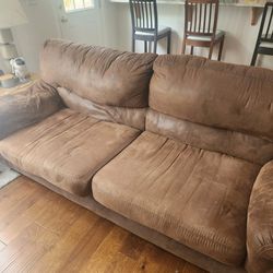 Brown suede sofa and loveseat