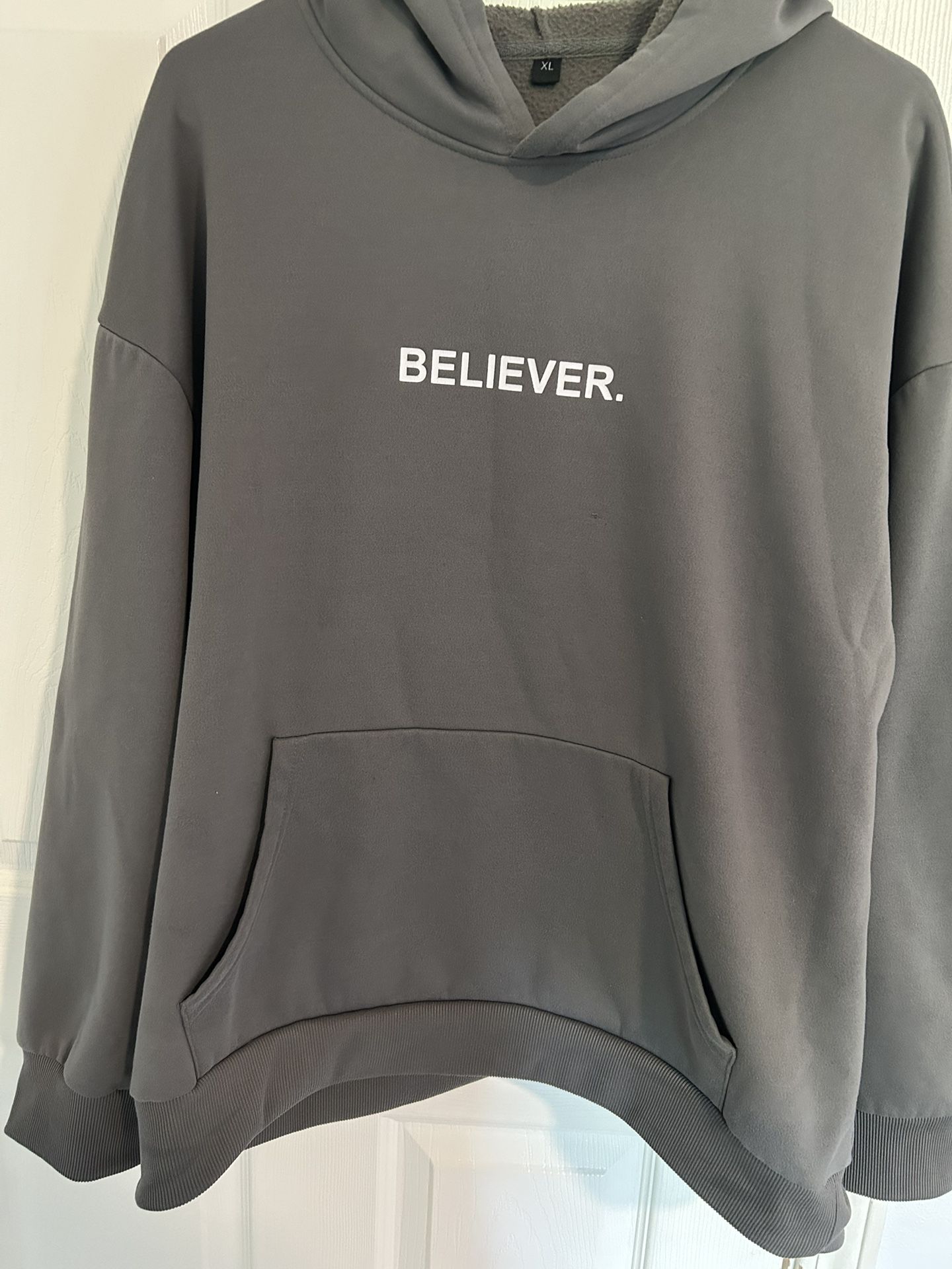 BELIEVER. sweater