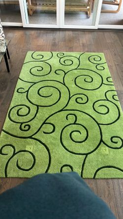 Gently used bright green rug.